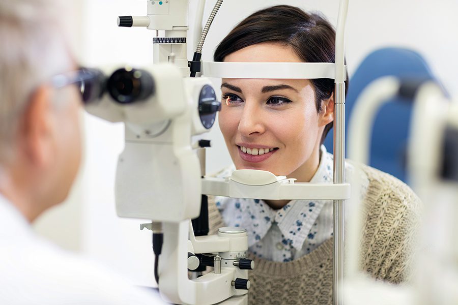 Individual Vision Insurance - Optometrist Examining the Eyesight of a Woman Patient